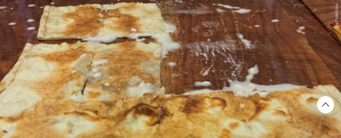 La Focaccia di Recco col formaggio Igp conquista il primo posto nell’atlante dei cibi liguri su TasteAtlas